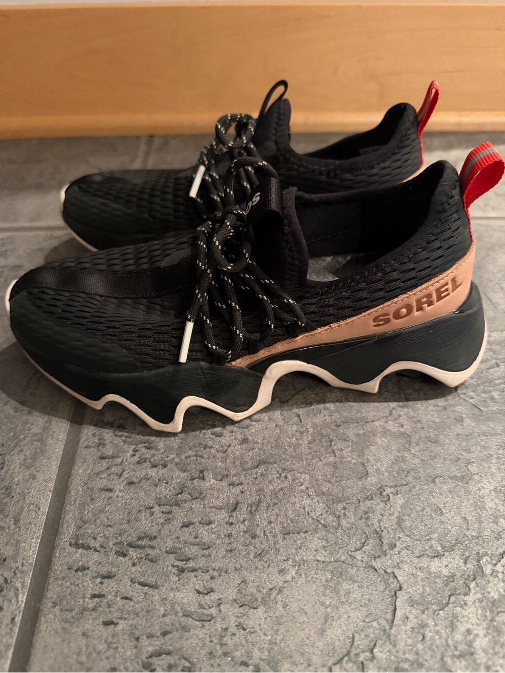 Sorel Women’s Black Kinetic Impact II Lace Sneakers with Tan and Red Accents